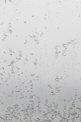 ice crystals melting on glass