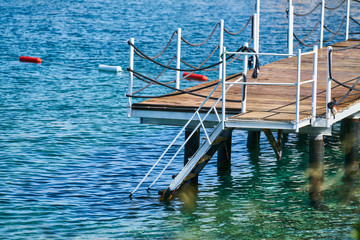 Old pier and blue sea background
