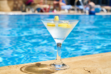 Tasty alcoholic beverage and pool view