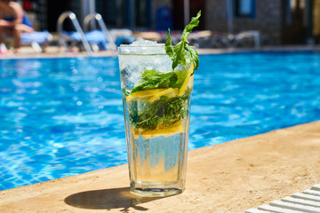 Tasty alcoholic beverage and pool view