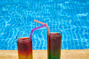 Tasty alcoholic beverage and pool view