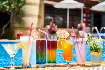 Tasty alcoholic beverage and pool view