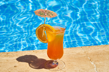 Tasty alcoholic beverage and pool view