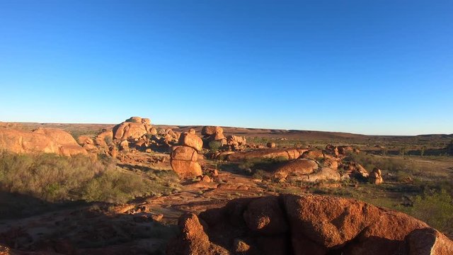 valley,no people,devils marbles,blue sky,australia landmark,australia landscape,australian landmarks,australia outback,outback,boulder,northern,tourist,reserve,vacation,conservation,granite,territory,