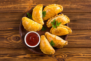 Latin American baked beef empanadas with sauce