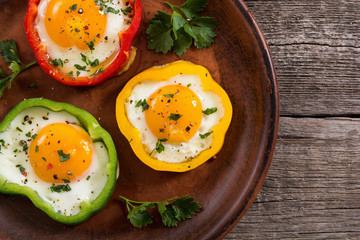 Yellow , red and green pepper with fried eggs