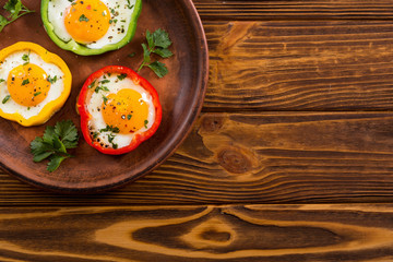 Yellow , red and green pepper with fried eggs