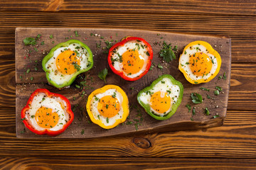 Yellow , red and green pepper with fried eggs