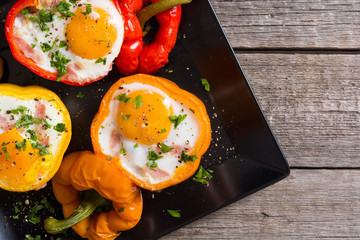 Baked pepper stuffed with bacon and eggs