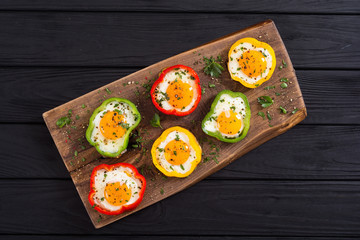 Yellow , red and green pepper with fried eggs