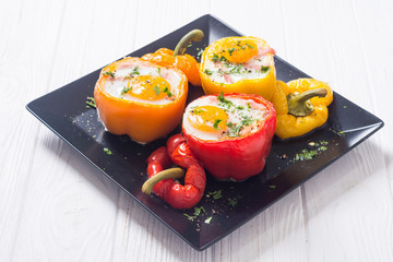 Baked pepper stuffed with bacon and eggs