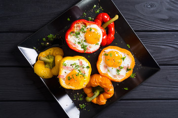 Baked pepper stuffed with bacon and eggs