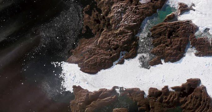 Very high-altitude overflight aerial of Disko Bay, Jakobshavn Glacier, Greenland. Clip loops and is reversible. Elements of this image furnished by NASA