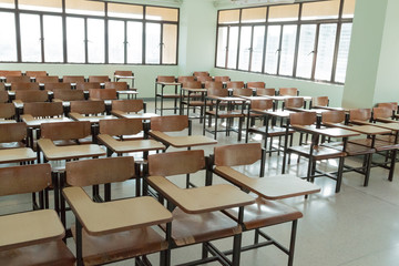 Desk and chairs in classroom