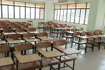 Desk and chairs in classroom background