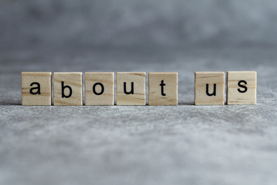 About us word written on wood cube