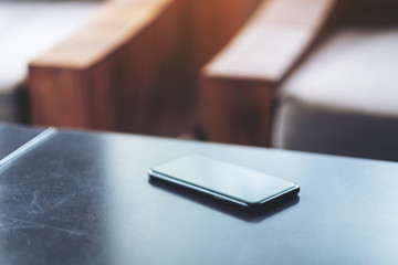 A single black mobile phone on the table