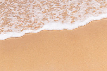 Fototapeta na wymiar close up beautiful beach and foam of wave summer nature background