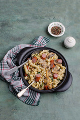 Pasta with mushrooms and sausages