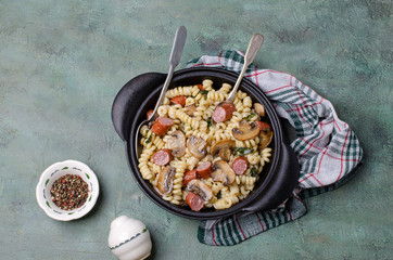 Pasta with mushrooms and sausages