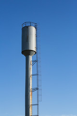 water tower on blue sky background