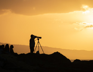 silhouette of photographer at sunset
