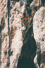Rock climbing on natural terrain.