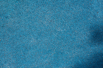 blue background with fine grainy texture, road surface