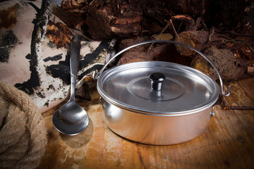 Tin pan and spoon on burlap