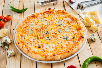 cheese pizza on the wooden background