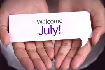 Hand showing welcome July.