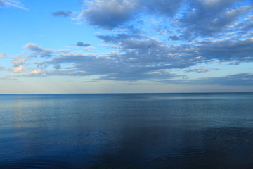 spring sea lake and blue sky and clouds sunset