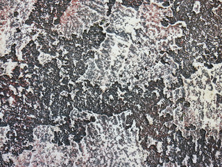 Decorative plaster under a stone. Texture. Background.