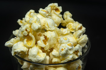 Popcorn is a snack made from corn kernels it is white color popular for people in many countries.