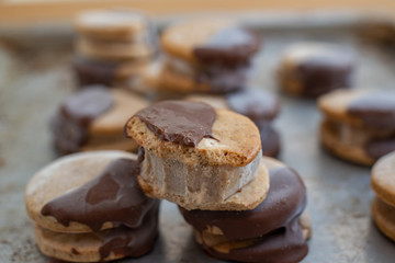 Sweet delicious ice cream cookie sandwiches on table