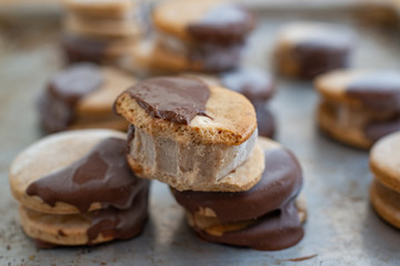Sweet delicious ice cream cookie sandwiches on table