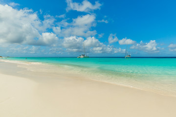 Tropical beach background with white sand beach and soft blur sea