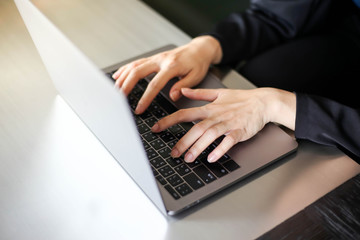 Close up of business women working with typing on laptop empty at workplace.Selective focus,business woman using laptop, searching web, browsing information