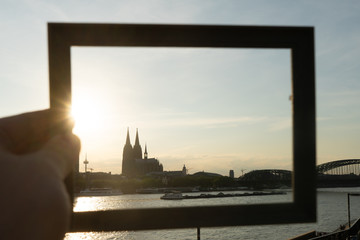Cologne cityscape and landscape and skyline during sunset trough a picture frame