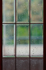 Rain drops on the summer window, nature background