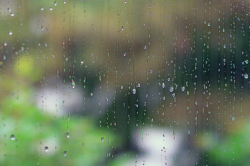 Rain drops on the summer window, nature background