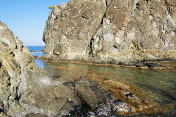 Sea rocky summer beach. Rocks and seashore.