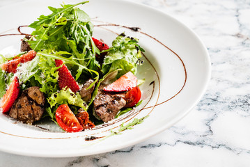 salad with strawberries and duck liver