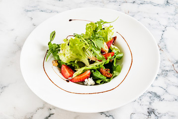 healthy salad with strawberries and cheese