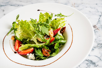 healthy salad with strawberries and cheese