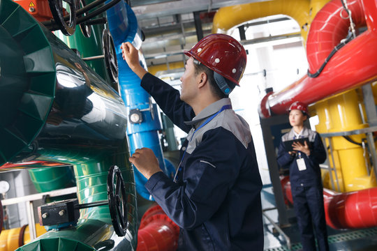 Technicians work in a factory