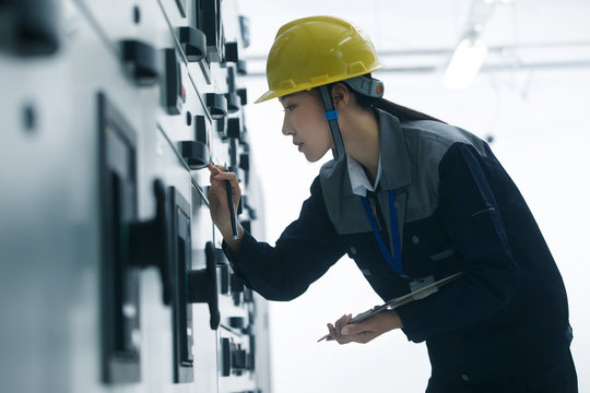 Technicians work in a factory