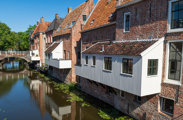 Fototapeta na wymiar The famous 'hanging kitchens' over the Damsterdiep in the old town of Appingedam, Groningen, Holland.