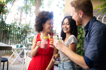 Multiracial group of friends having fun and talking