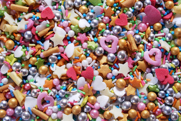 Fototapeta na wymiar Colorful candy sprinkles background 